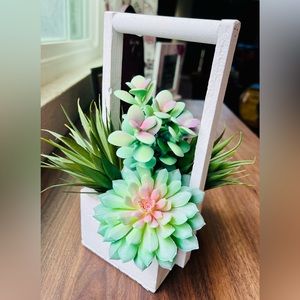 Faux flowers succulent in basket